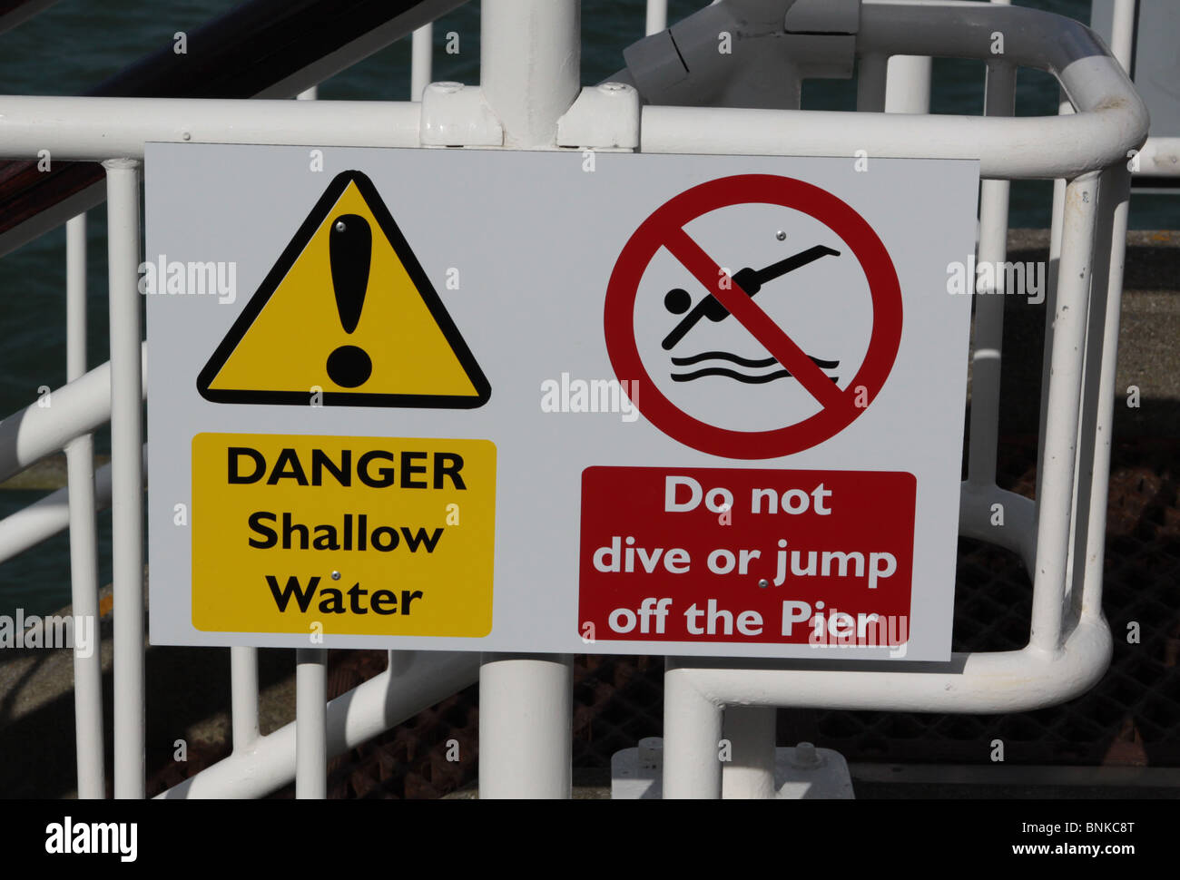 Warning signs on Bournemouth Pier Stock Photo Alamy