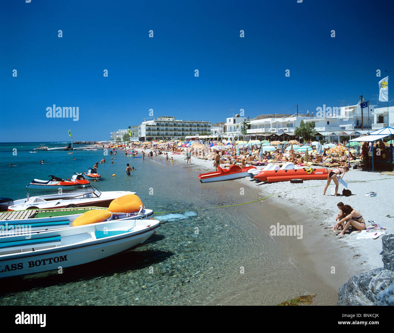 Beach scene at the popular resort of Kardamena on the island of Kos Stock Photo