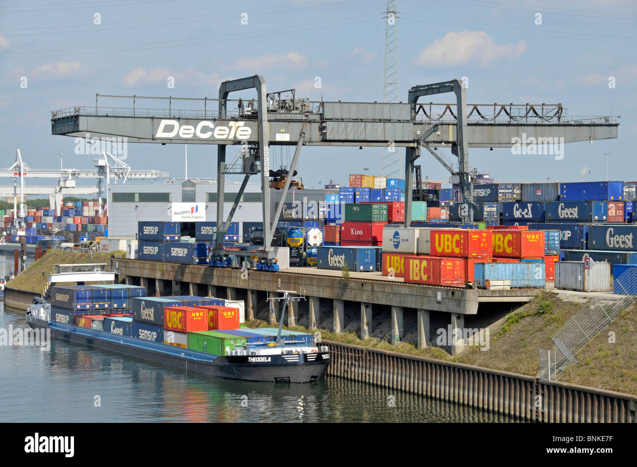Europe Germany North Rhine-Westphalia Duisburg Binnenhafen freighter transport ship freight goods load load many fill in Stock Photo
