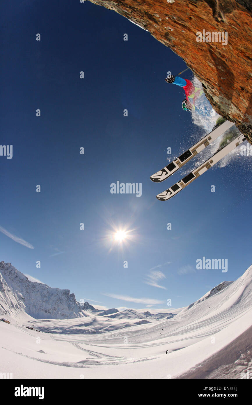 Switzerland winter sports skier cliff surplus overhang jump snow winter