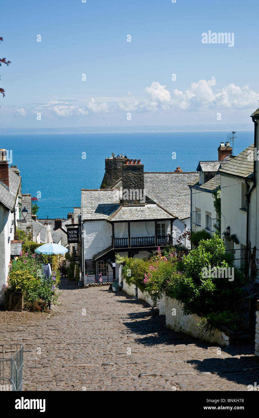colourful street in Clovelly Cornwall England, with Barnstaple Bay in background Stock Photo