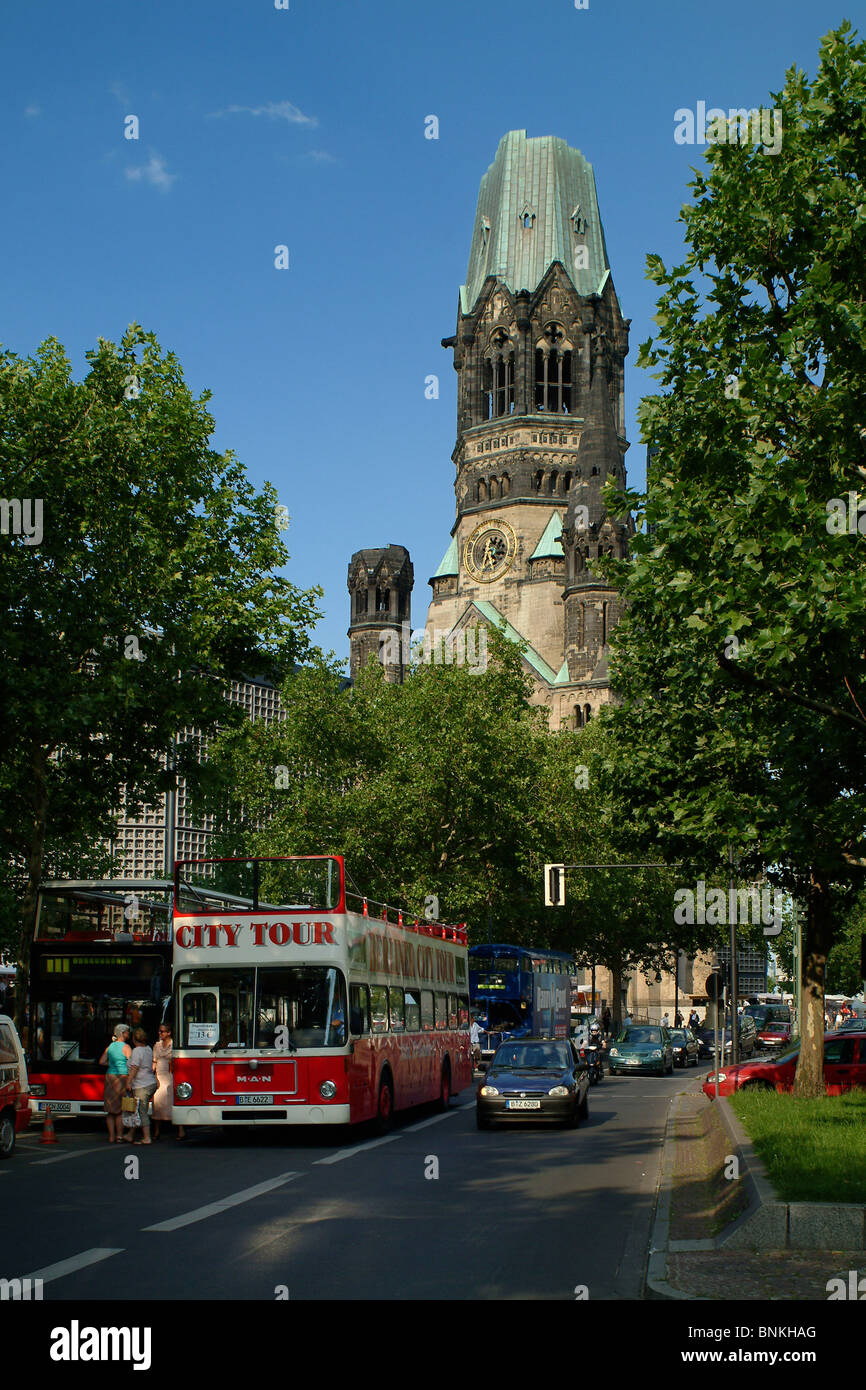 Kurfuerstendamm boulevard with sightseeing bus and Kaiser Wilhelm Memorial Church on Breitscheidplatz square, Berlin, Germany. Stock Photo