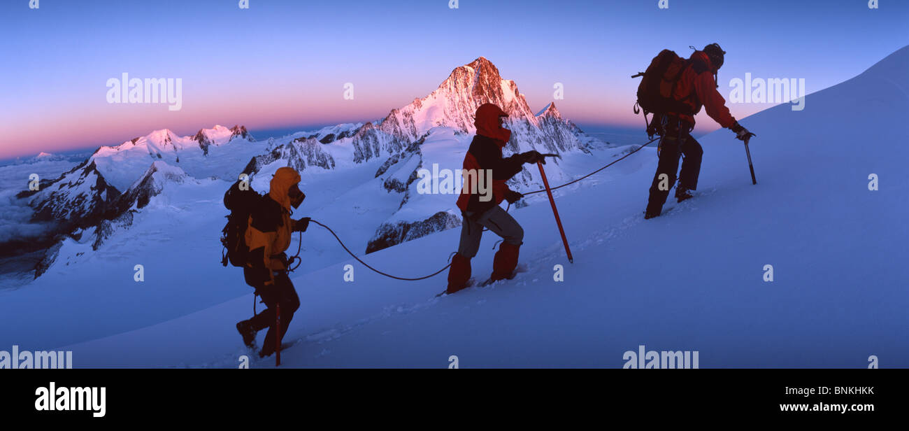 Switzerland walking hiking climbing mountain tour rope group three ...