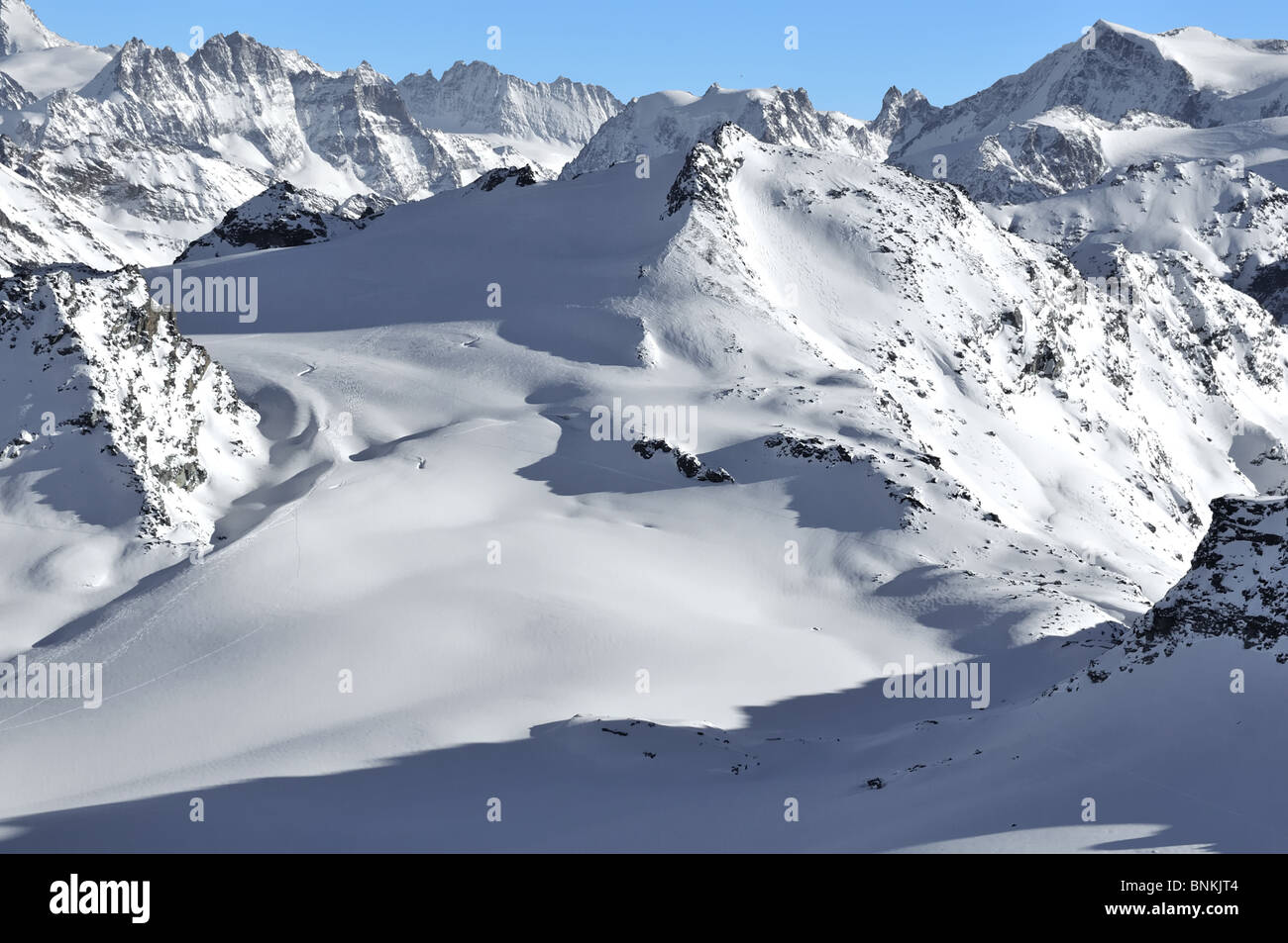 vertically precipitously Switzerland Valais Swiss snow burr rock cliff  summit peak mountains herens rosablanche mont blanc de Stock Photo - Alamy