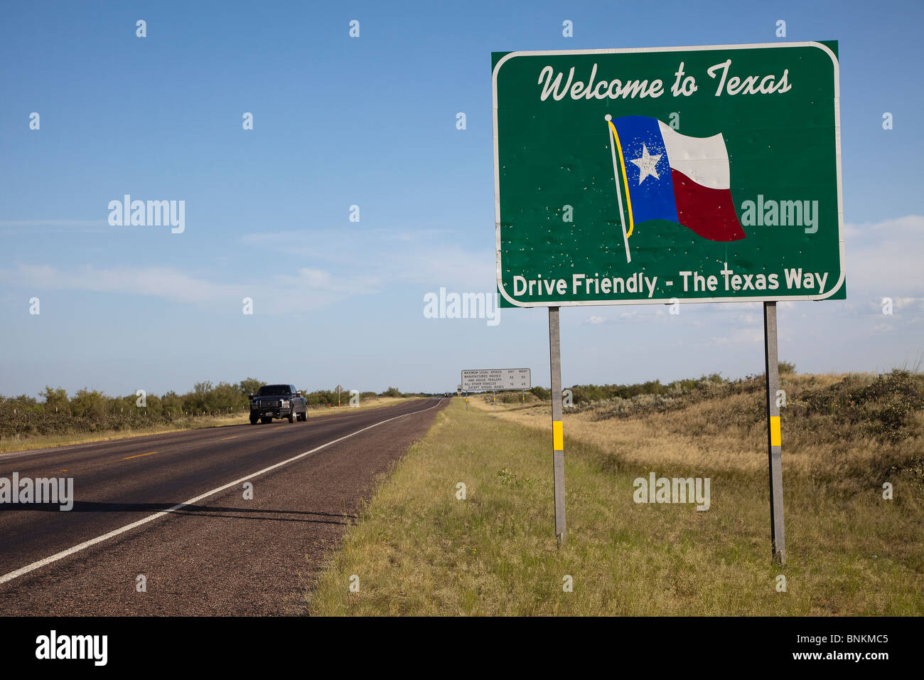 Texas welcome sign Drive Friendly with bullet holes on highway 18 Texas USA Stock Photo