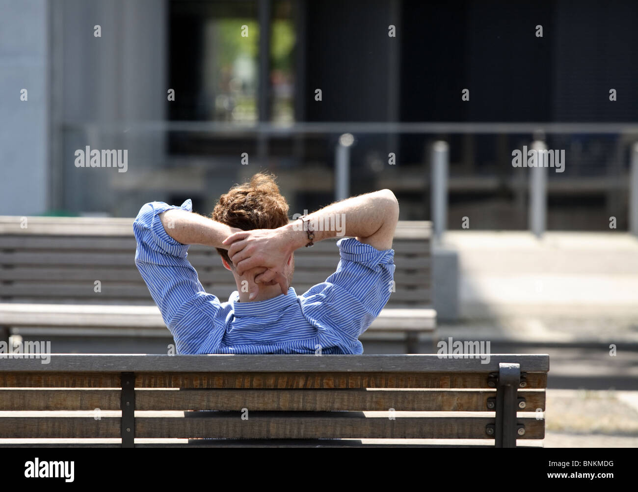 Relaxed man sitting hi-res stock photography and images - Alamy