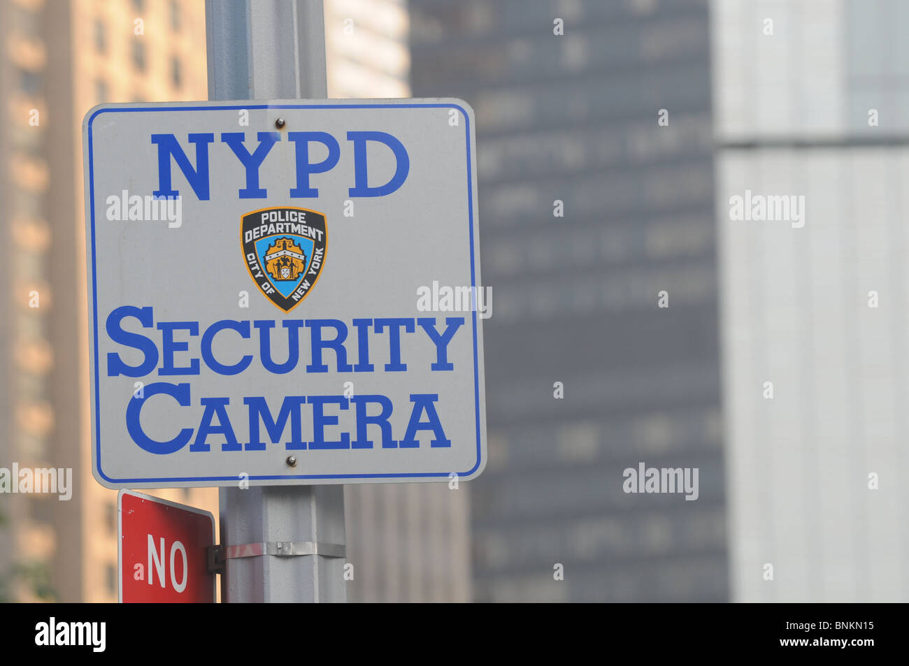 street sign information as to the presence of security cameras in manhattan new york city USA Stock Photo