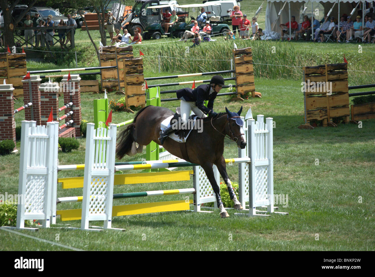 Horse and rider jump fence at Stuart Horse Trials 1020 in Show Jumping