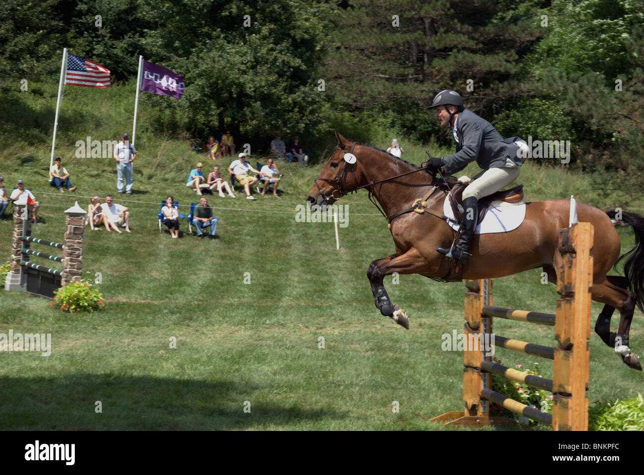 Rider and horse jumping fence hi-res stock photography and images - Alamy