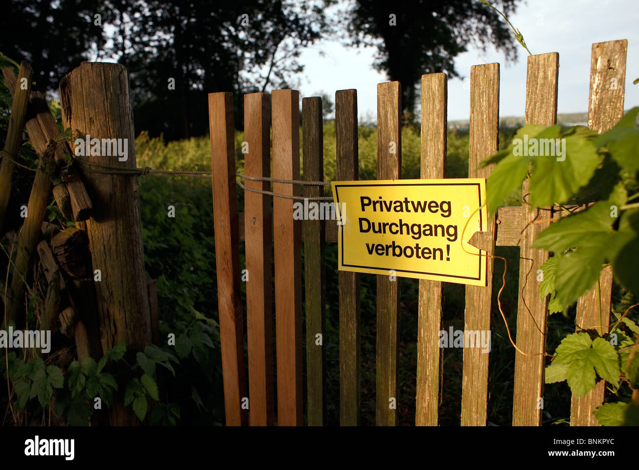 A sign saying in German: private road, trespassing vorbidden! Stock Photo