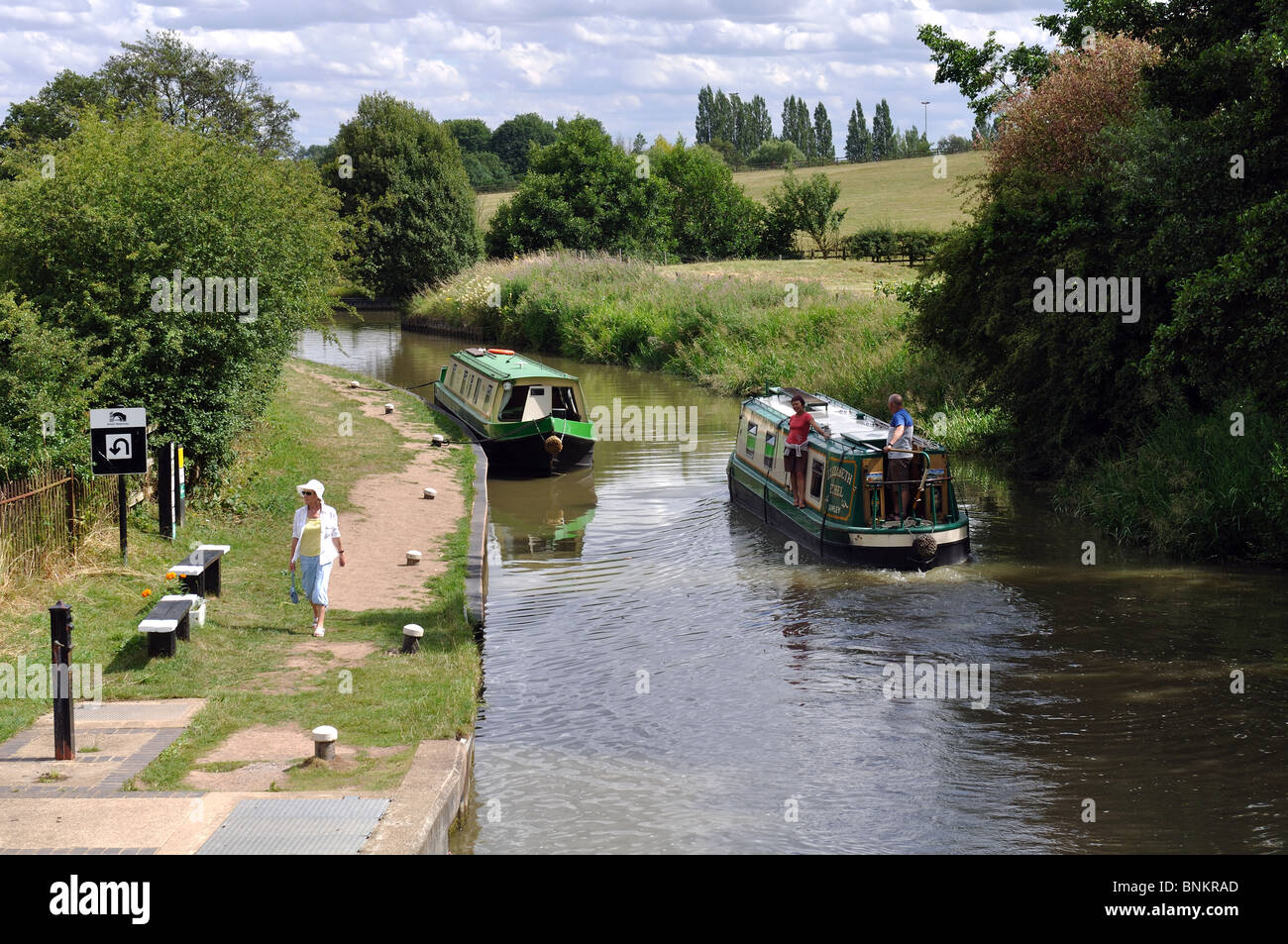 Narrowboat leaving Watford Locks, Grand Union Canal, Northamptonshire, England, UK Stock Photo