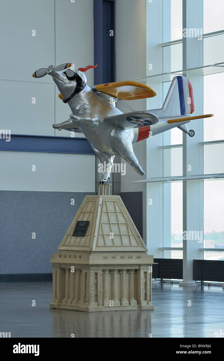 Flying biplane pig sculpture called The Spirit of Pigcinnati displayed
