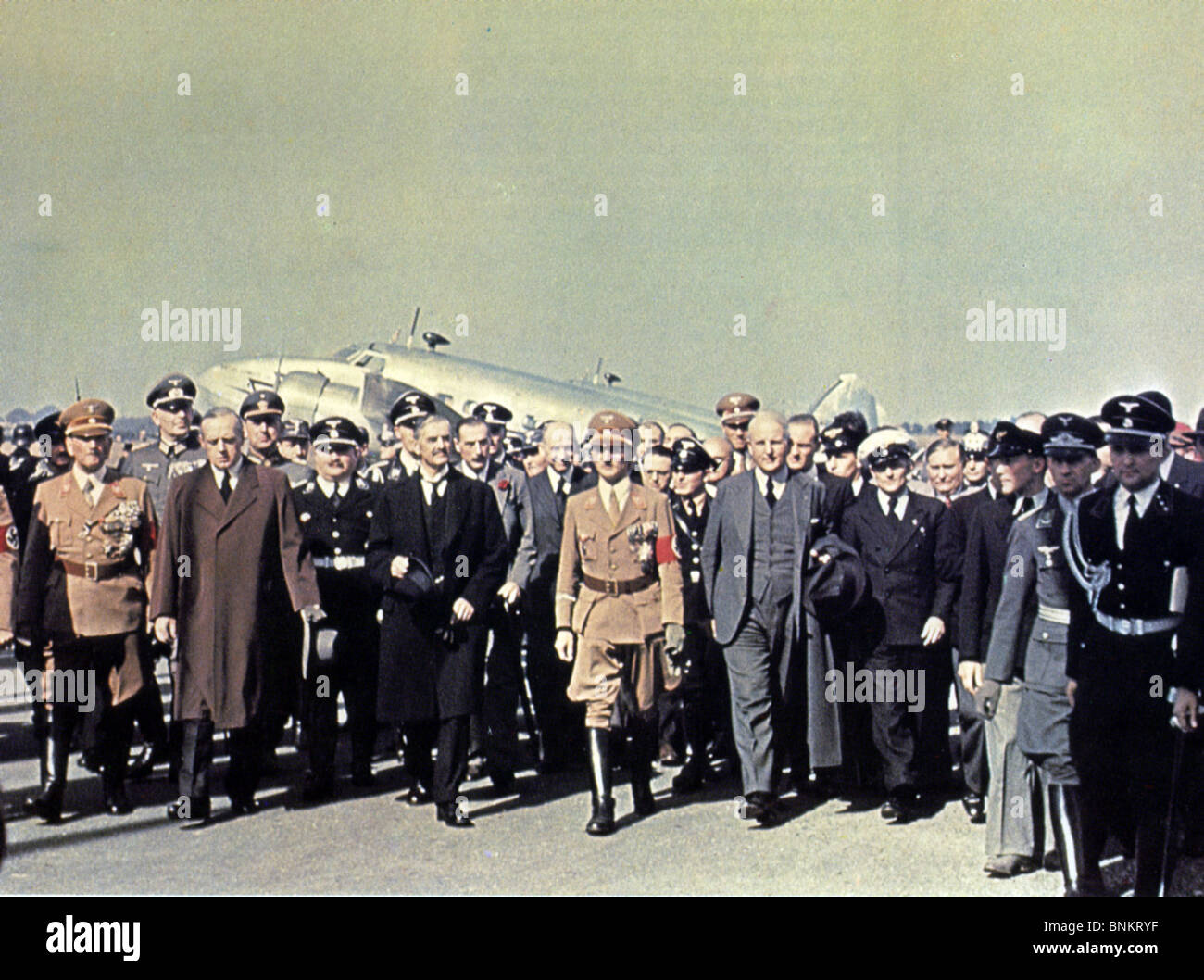 MUNICH CRISIS  Prime Minister Neville Chamberlain (dark coat at left) arrives at Munich 29 September 1938. See Description below Stock Photo