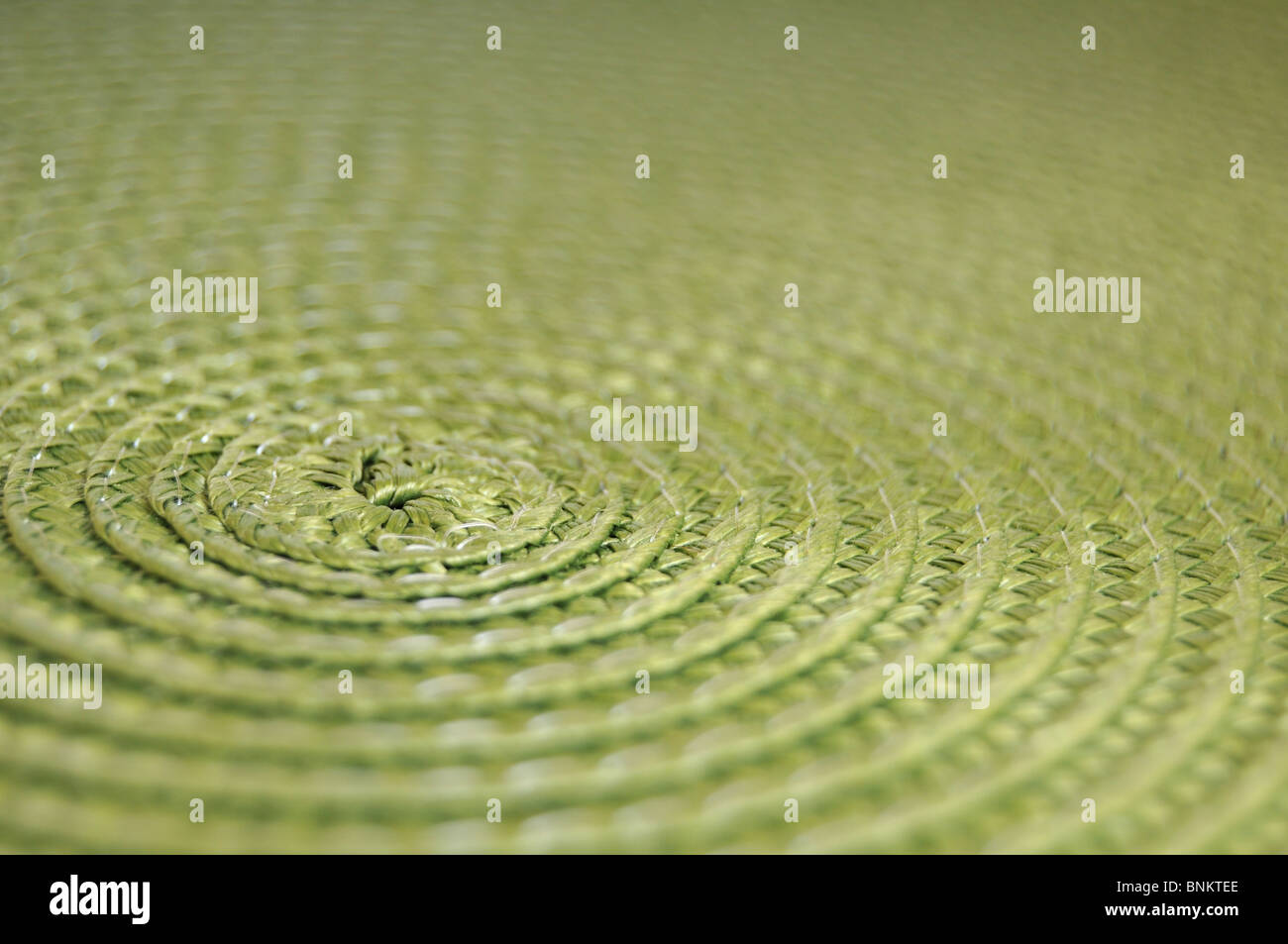 Circular placemat background. Close up of a dinner place mat. Stock Photo