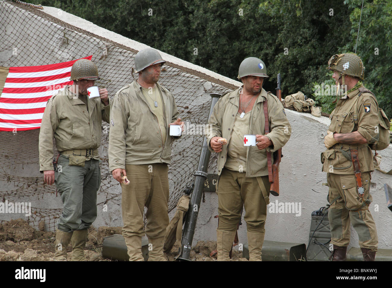 American soldiers having a tea break and at ease. They are re-enacting a second world war theme. War and Peace show, Kent 2010. Stock Photo