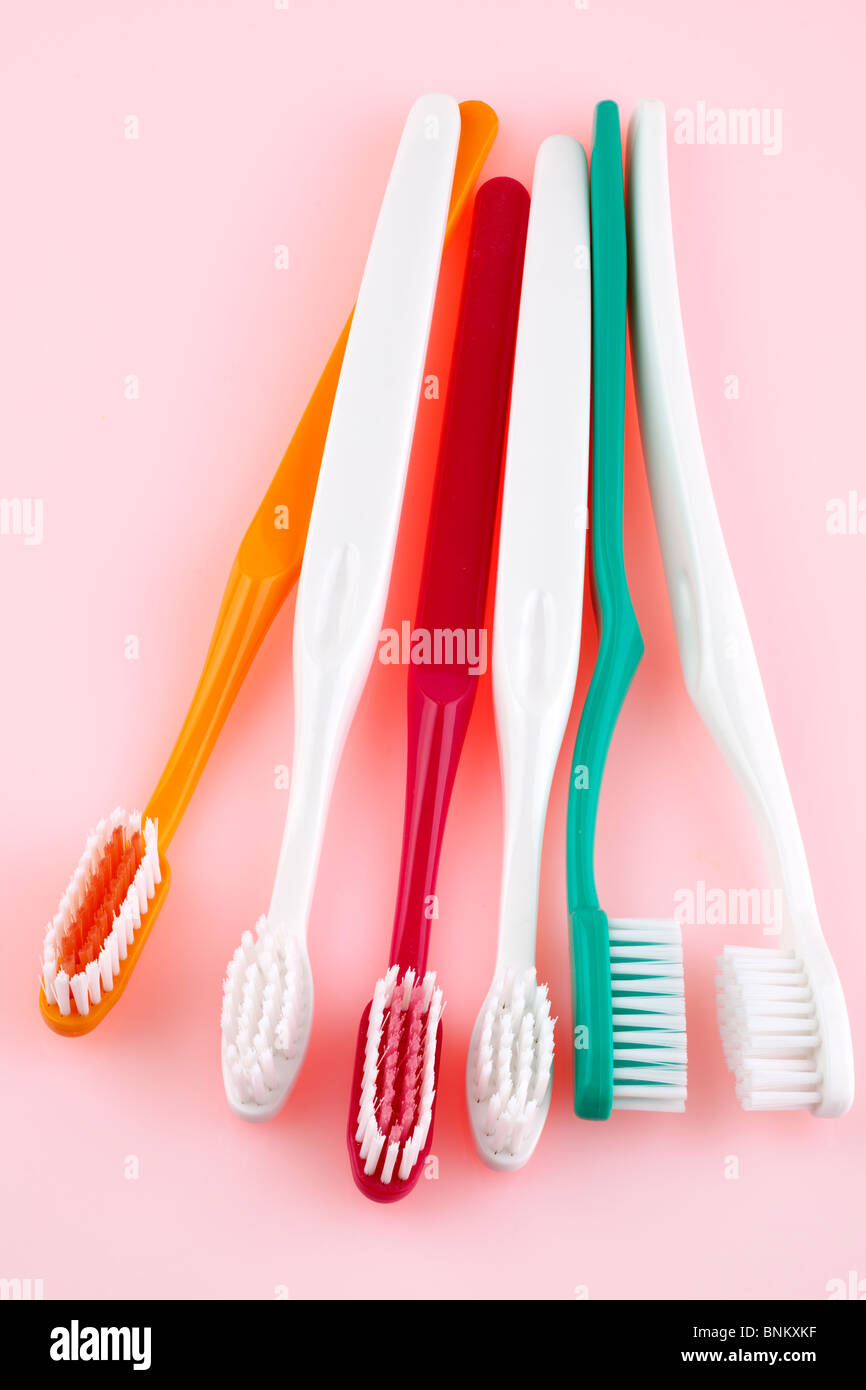 Six coloured toothbrushes Stock Photo