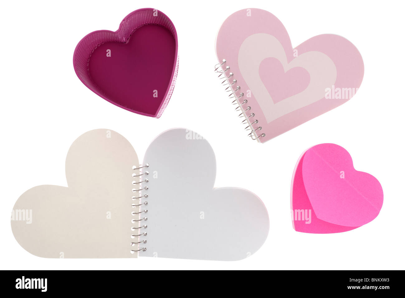 Heart shaped stationary pen holder and three notebooks Stock Photo