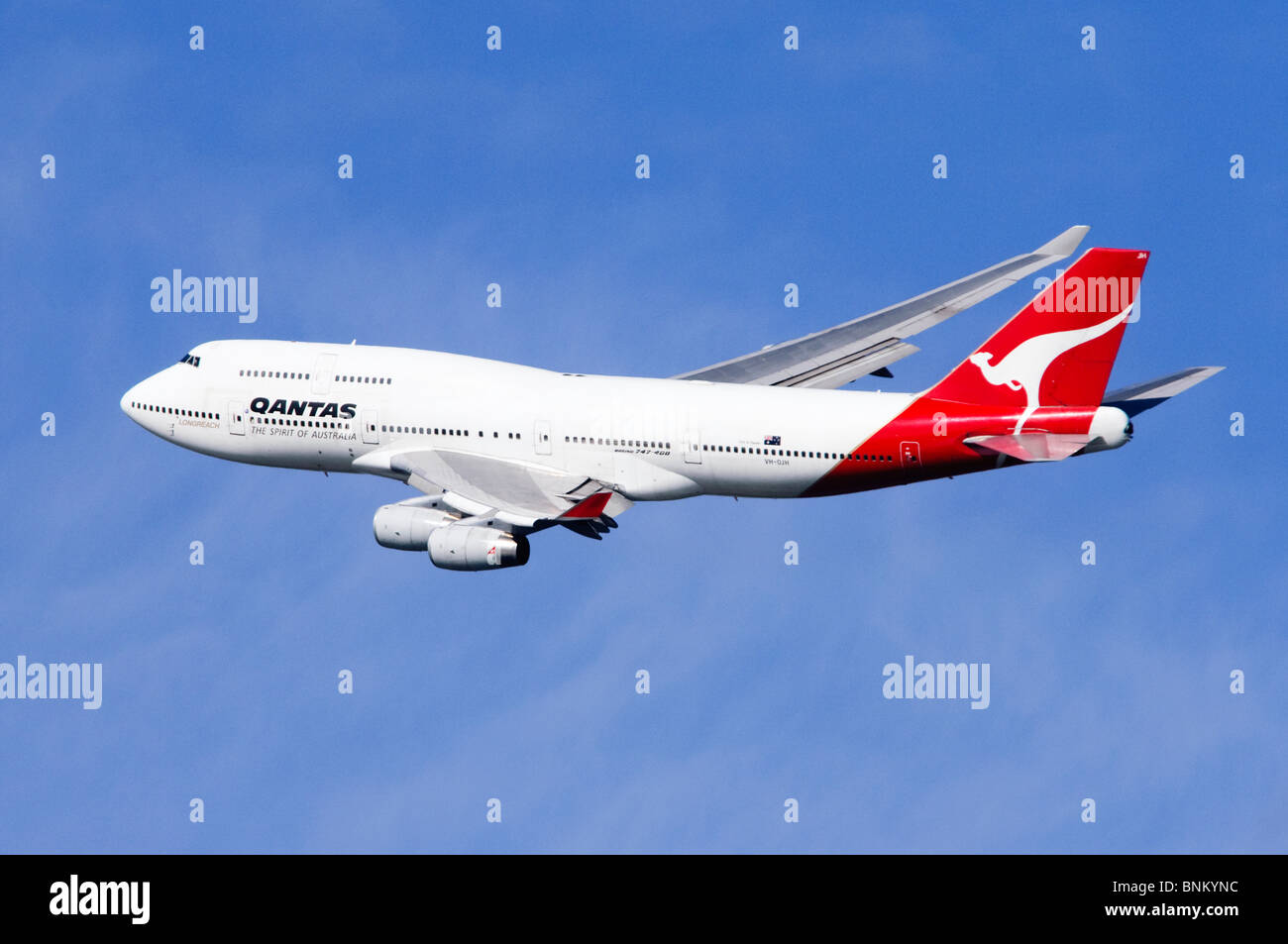 Boeing 747 operated by Qantas climbing out from take off at London Heathrow Airport, UK. Stock Photo