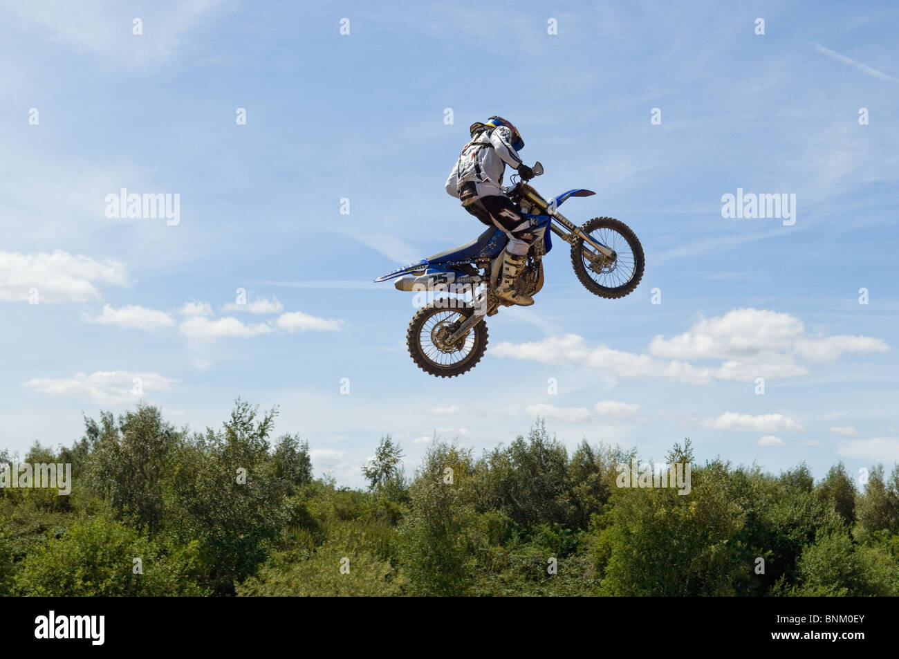 Motocross competitor jumping through the air at Doncaster Moto Parc, South Yorkshire Stock Photo