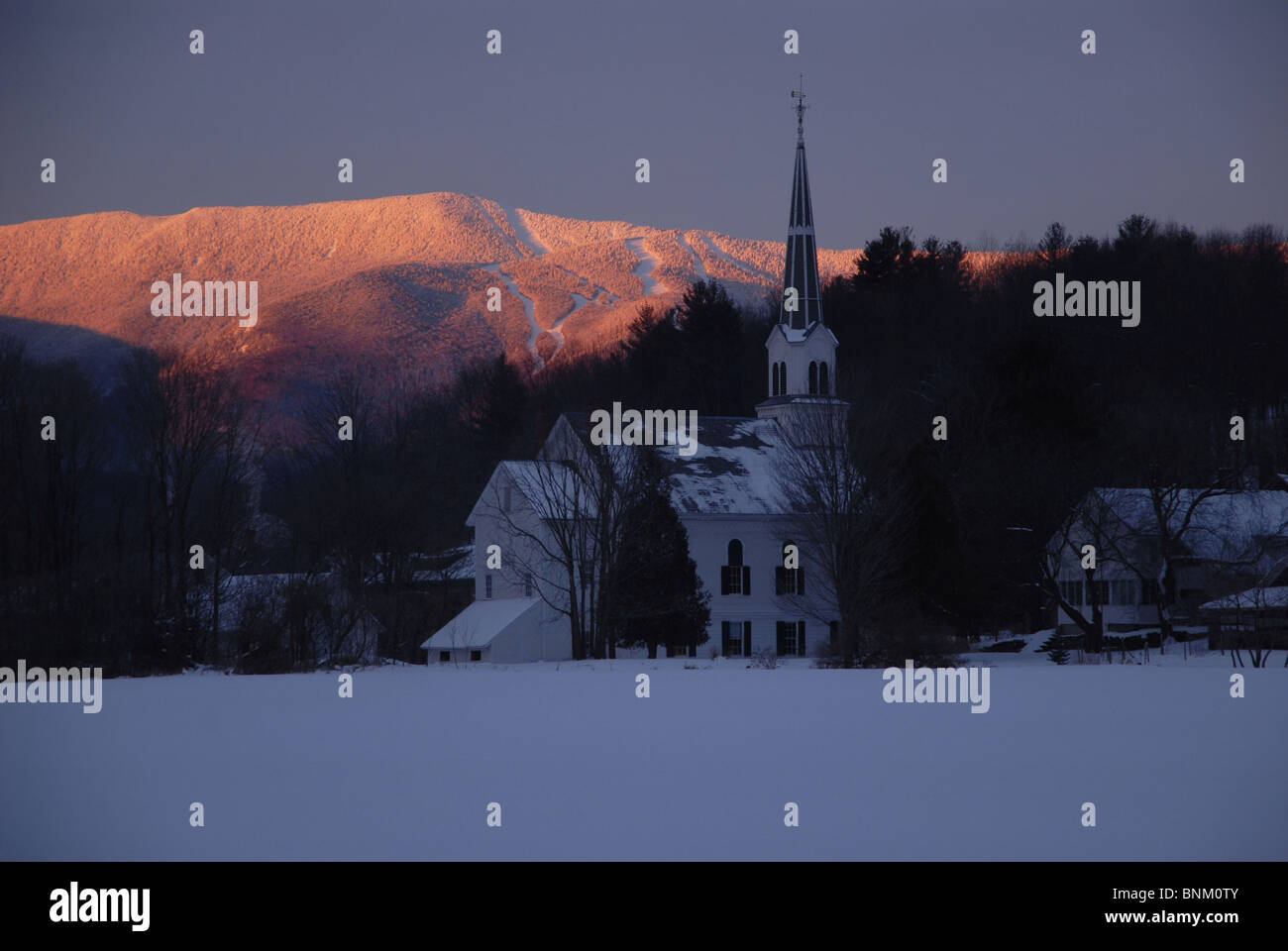 A church sits in the foreground in Waitsfield, VT, as Sugarbush Resort