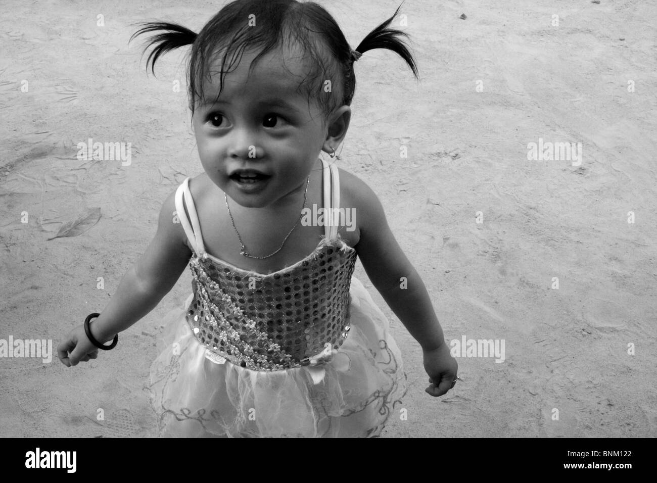 Smiling little girl with pigtails Stock Photo