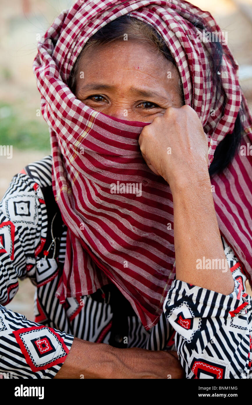 Khmer woman with her face covered in a krama - Phnom Penh, Cambodia Stock Photo