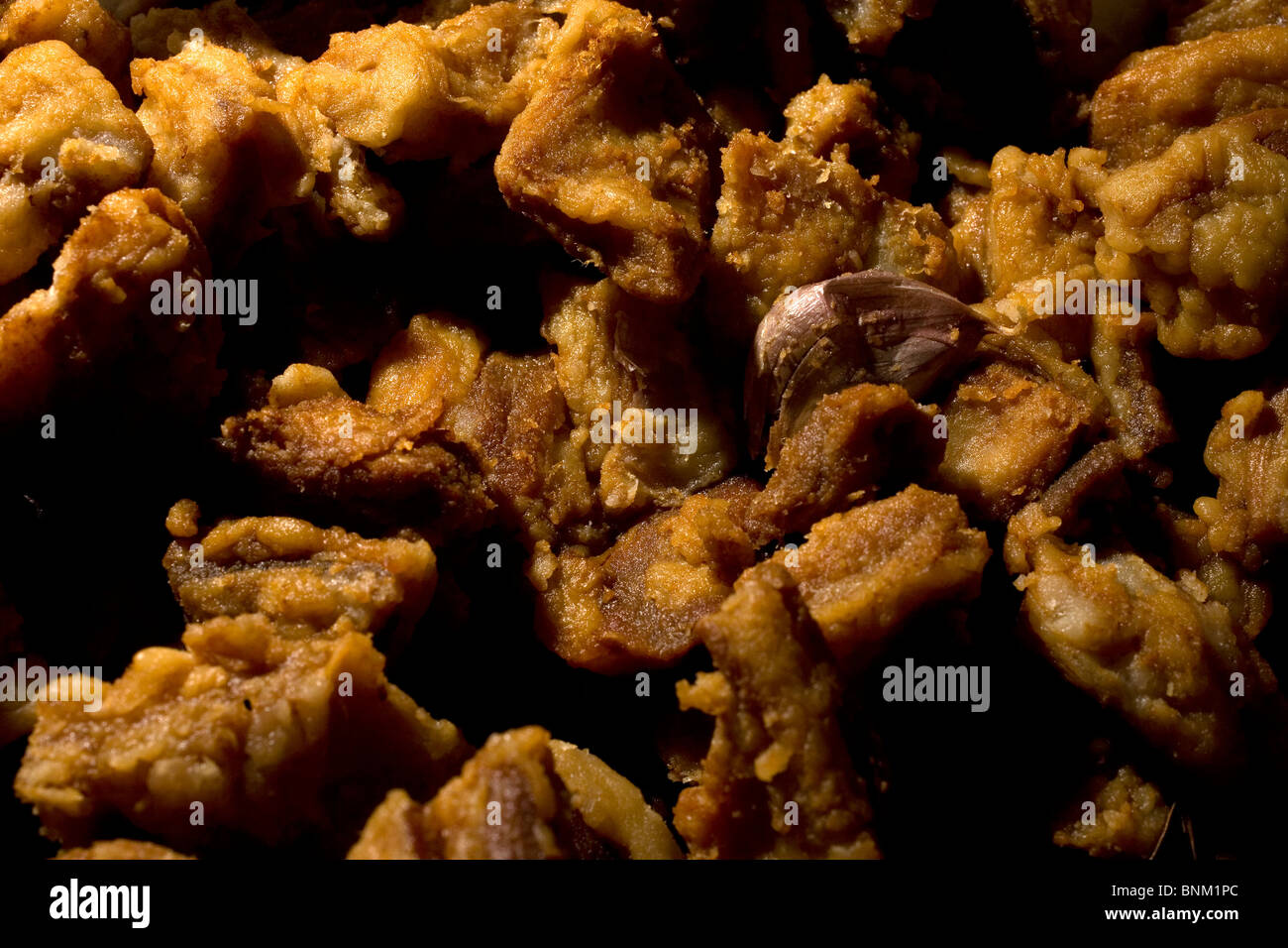 Pork cracklings, or chicharrones, made from Spanish Iberian pigs sit