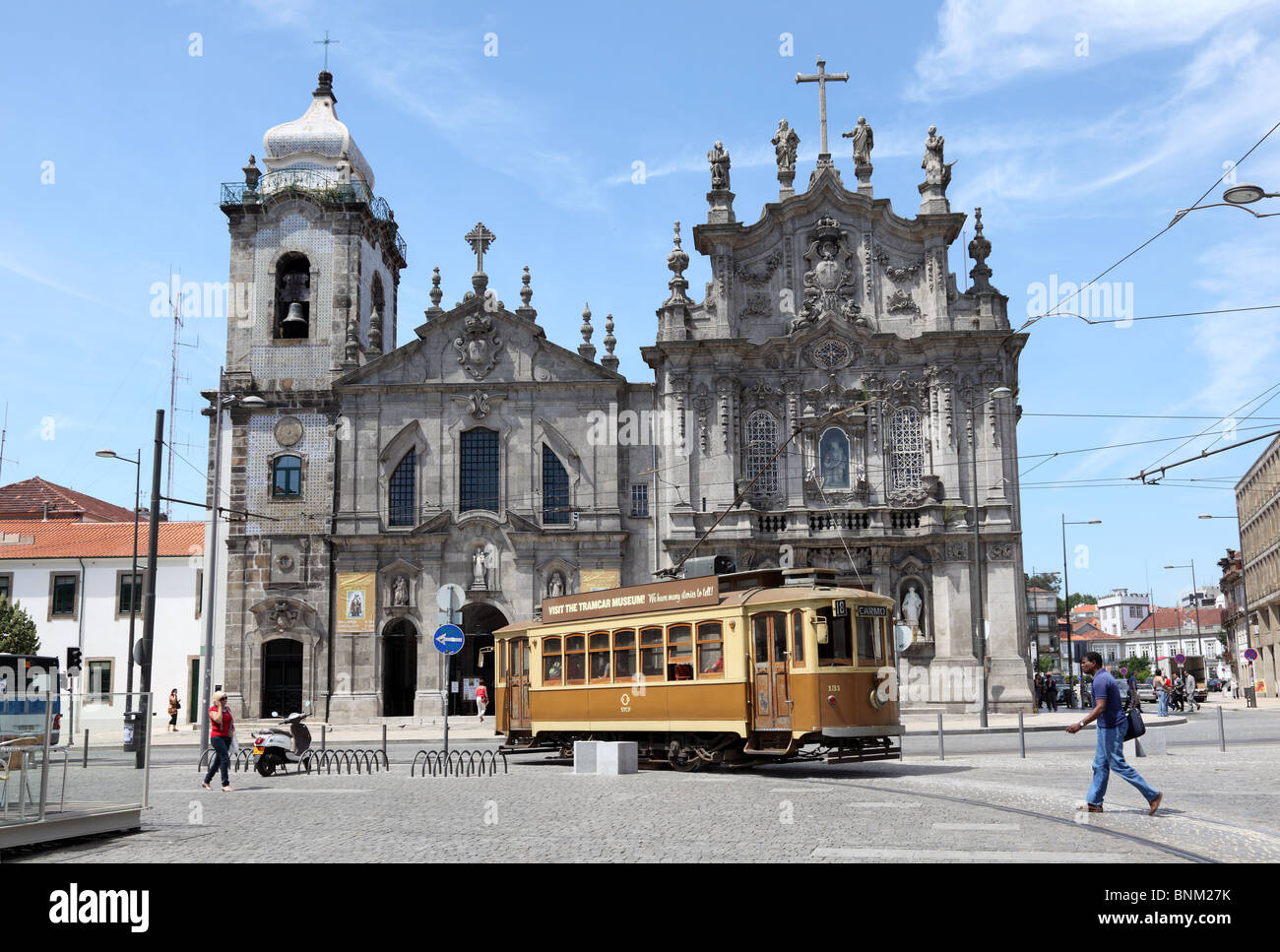 Old trolley car in front of a church in Porto, Portugal Stock Photo
