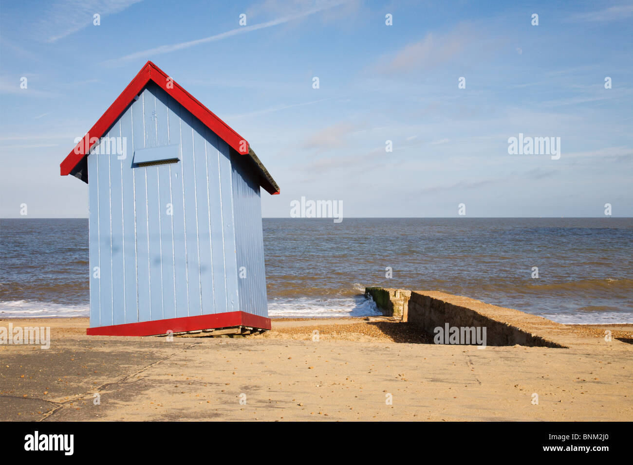 A wobbly, unstable, but nicely painted beach hut at Felixstowe. Stock Photo