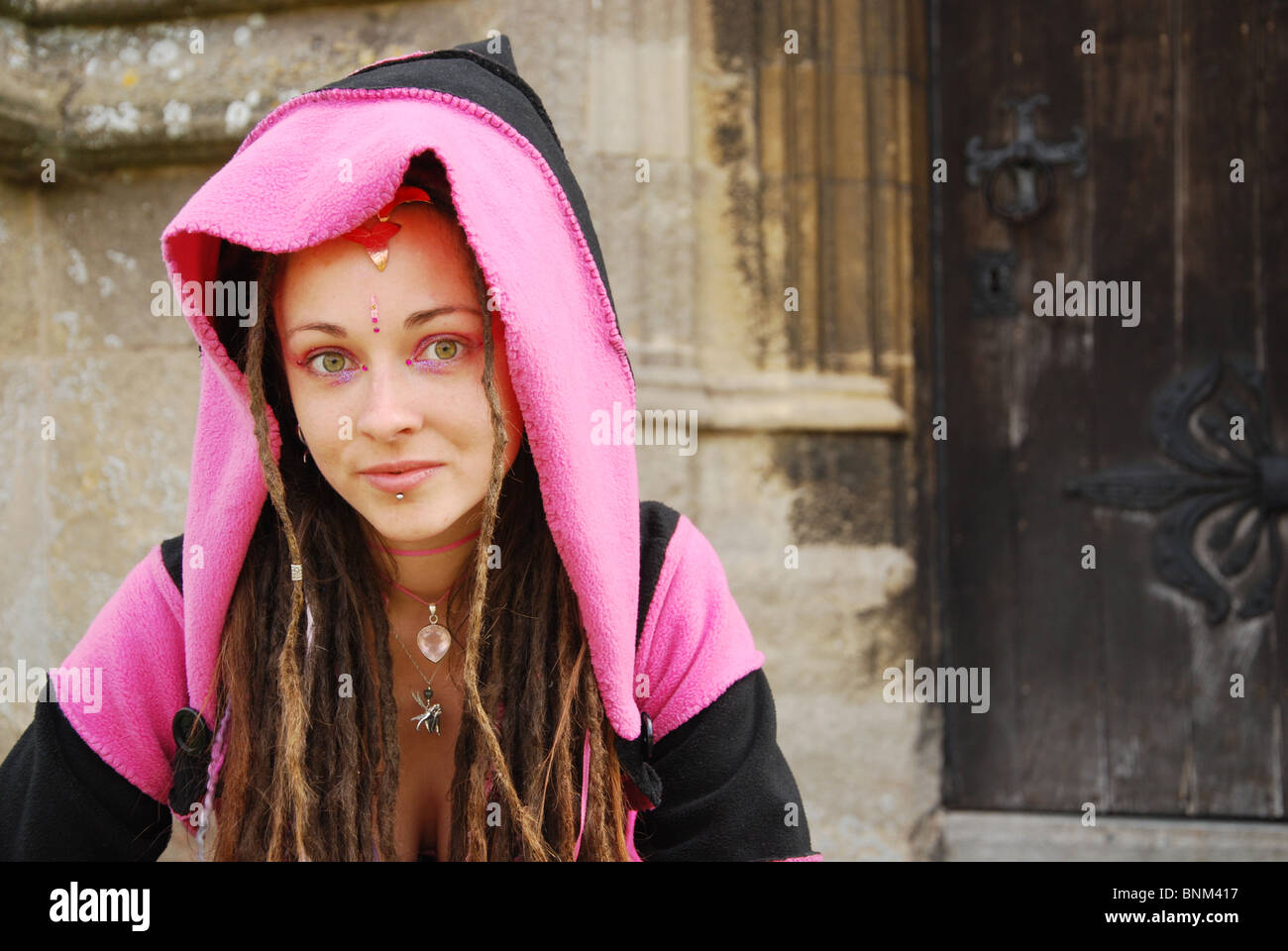 pink hooded fairy in Glastonbury United Kingdom Stock Photo