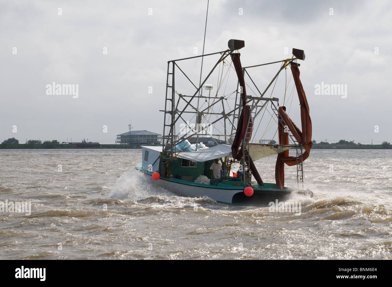 Local fisherman returning from skimming during 2010 BP oil spill Stock Photo