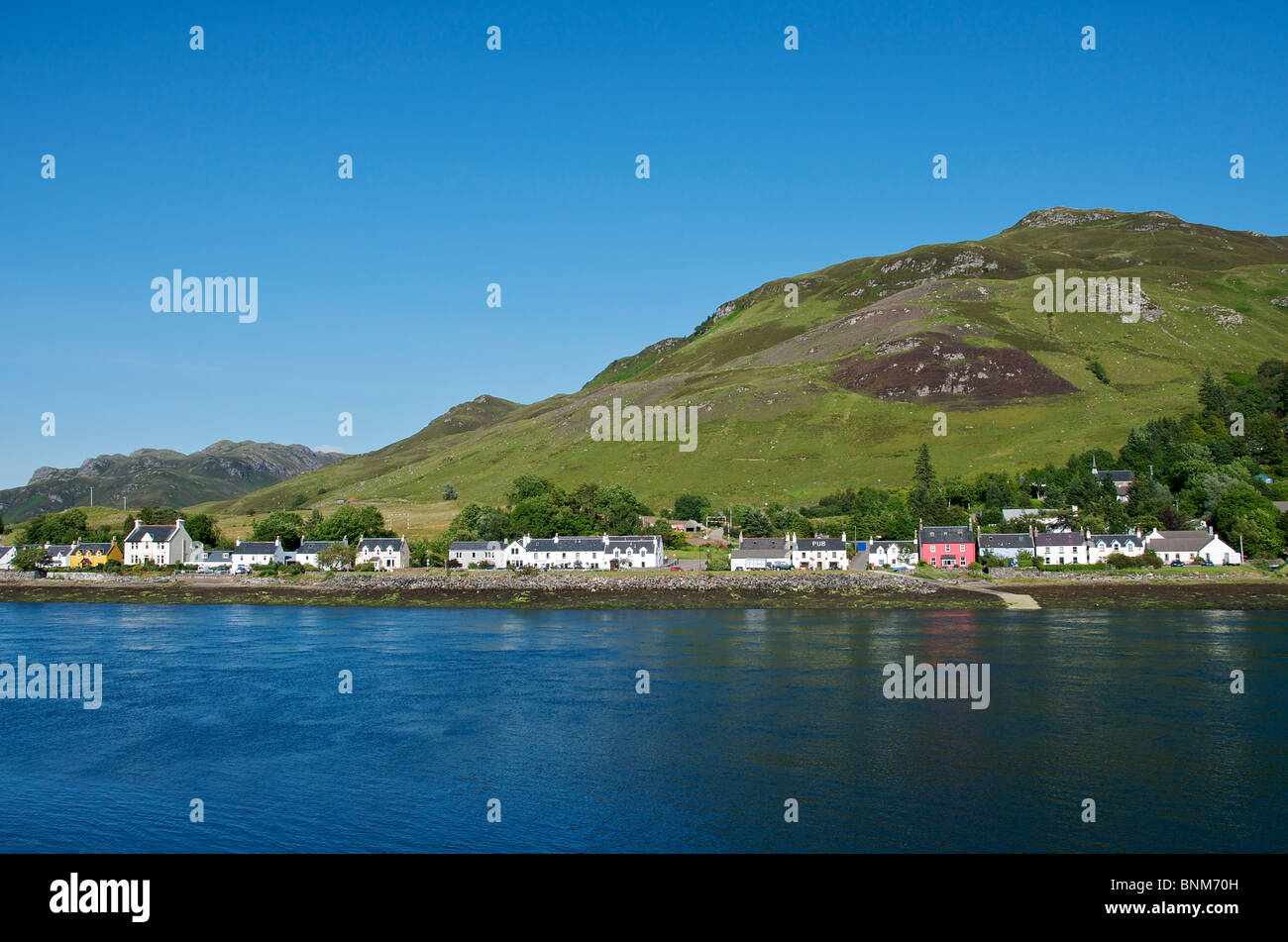 Row of waterfront houses Dornie Loch Duitch in Glen Shiel North West Scotland Stock Photo
