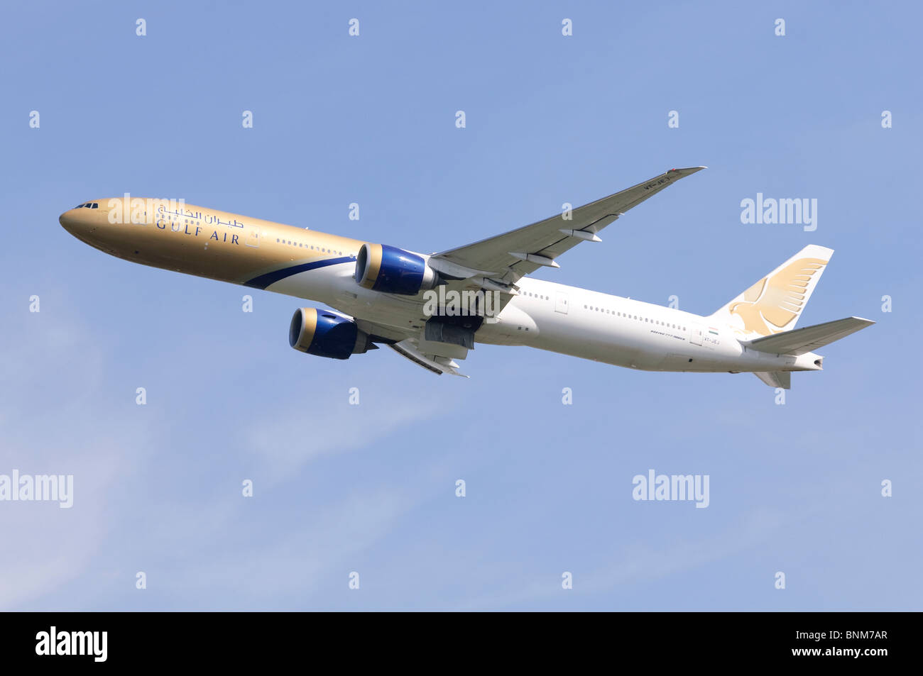 Boeing 777 operated by Gulf Air climbing out from take off at London Heathrow Airport, UK. Stock Photo