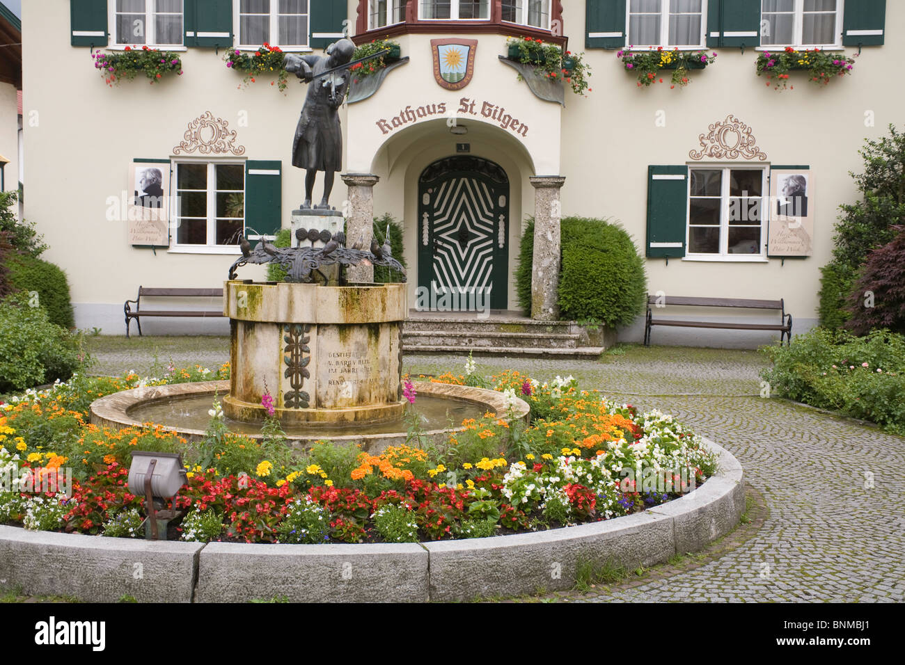 St Gilgen Upper Austria Europe EU Mozart statue in a flower bed in front of Rathaus Stock Photo