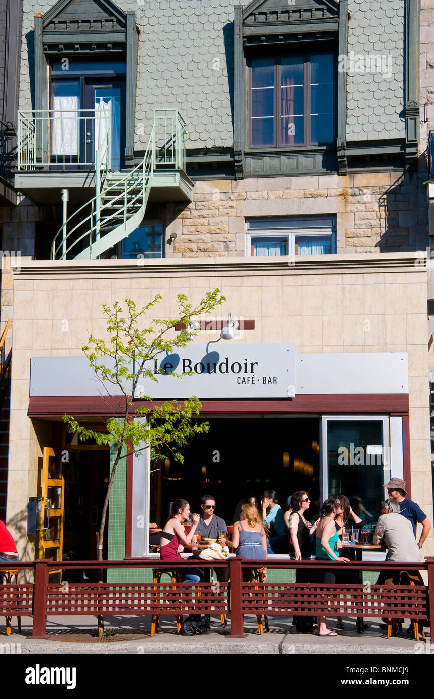 People enjoying the summer on sidewalk terrace Avenue Mont Royal in the heart of the Plateau