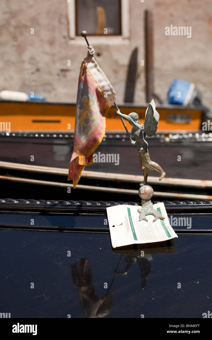 detail of venetian gondola, figurine holding flag, list of transportation rates attached Stock Photo