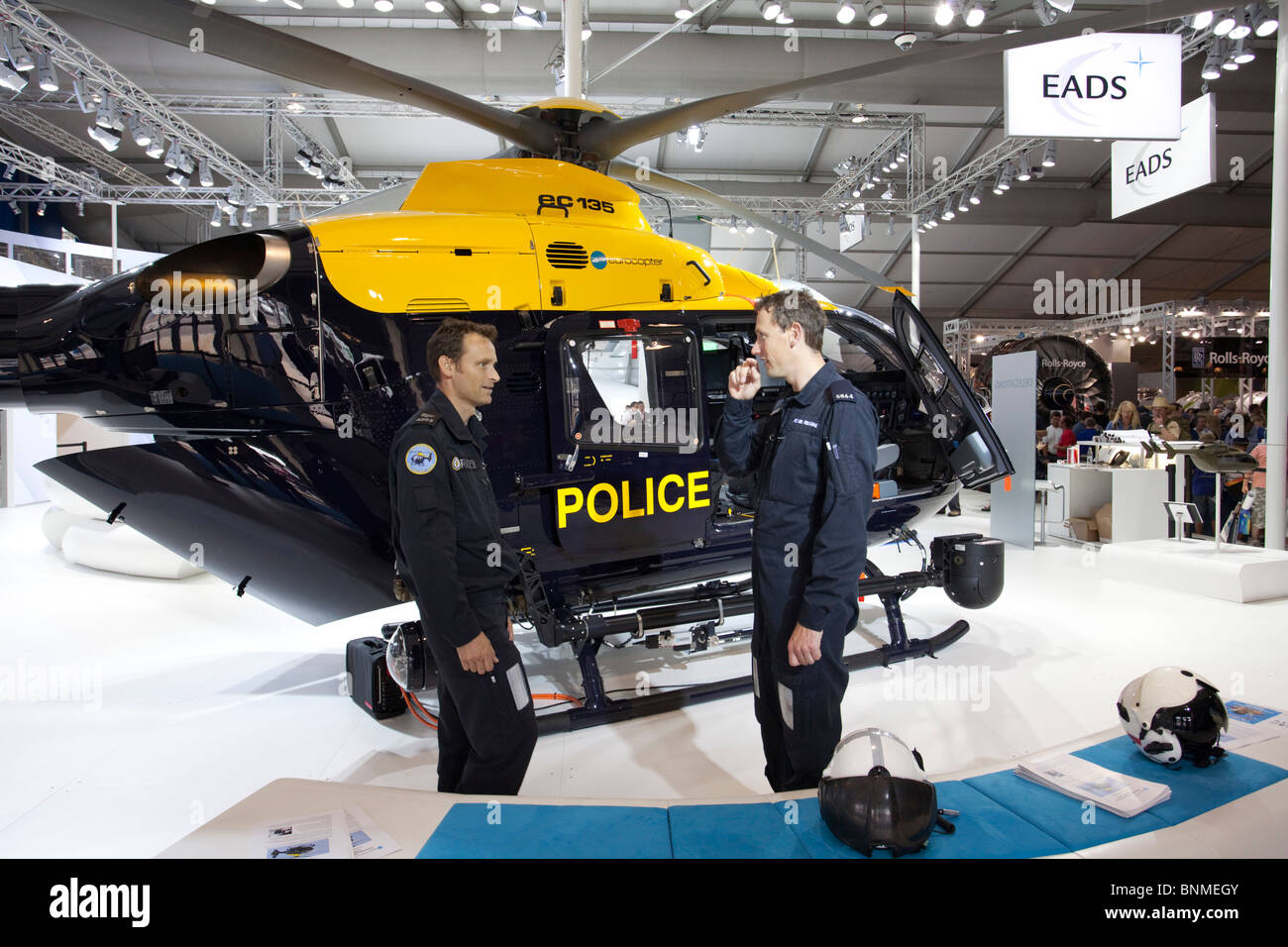 police helicopter and two personnel on display stand. Stock Photo