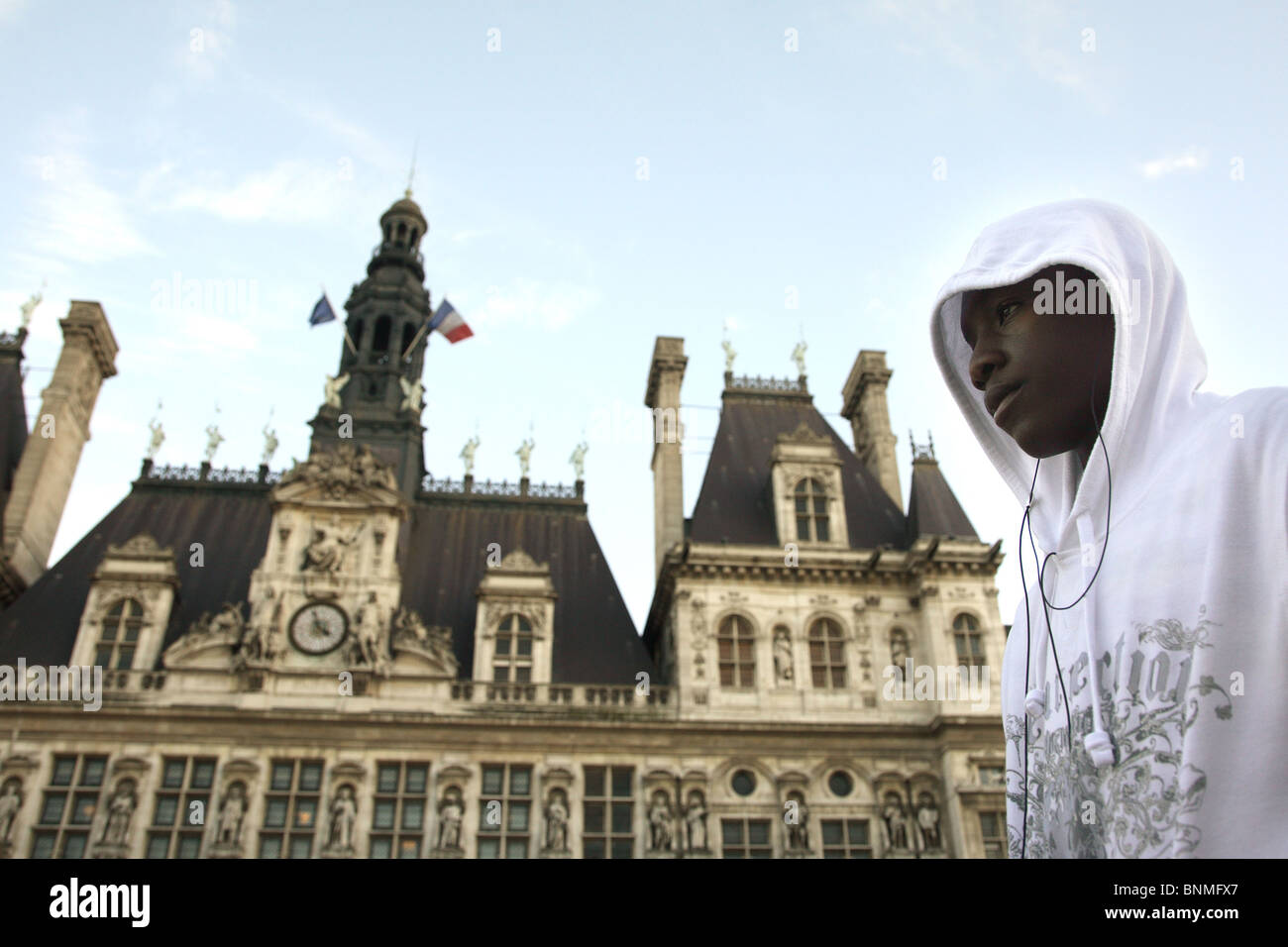 Young man in front of the city hall in Paris, France Stock Photo