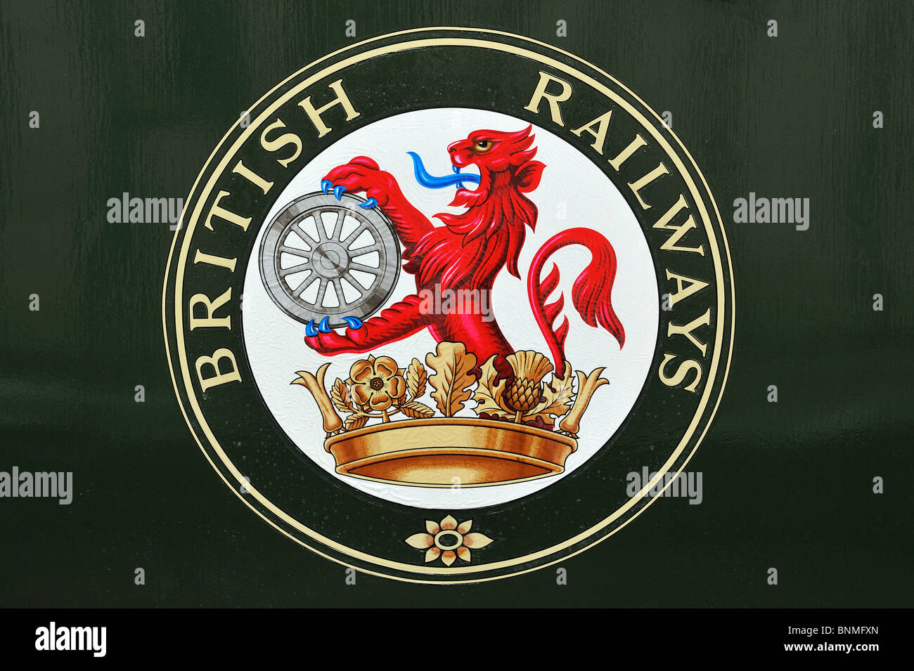 Green logo of British Railways featuring a lion holding a wheel (ferret and dartboard) at the Boat of Garten station in Scotland Stock Photo