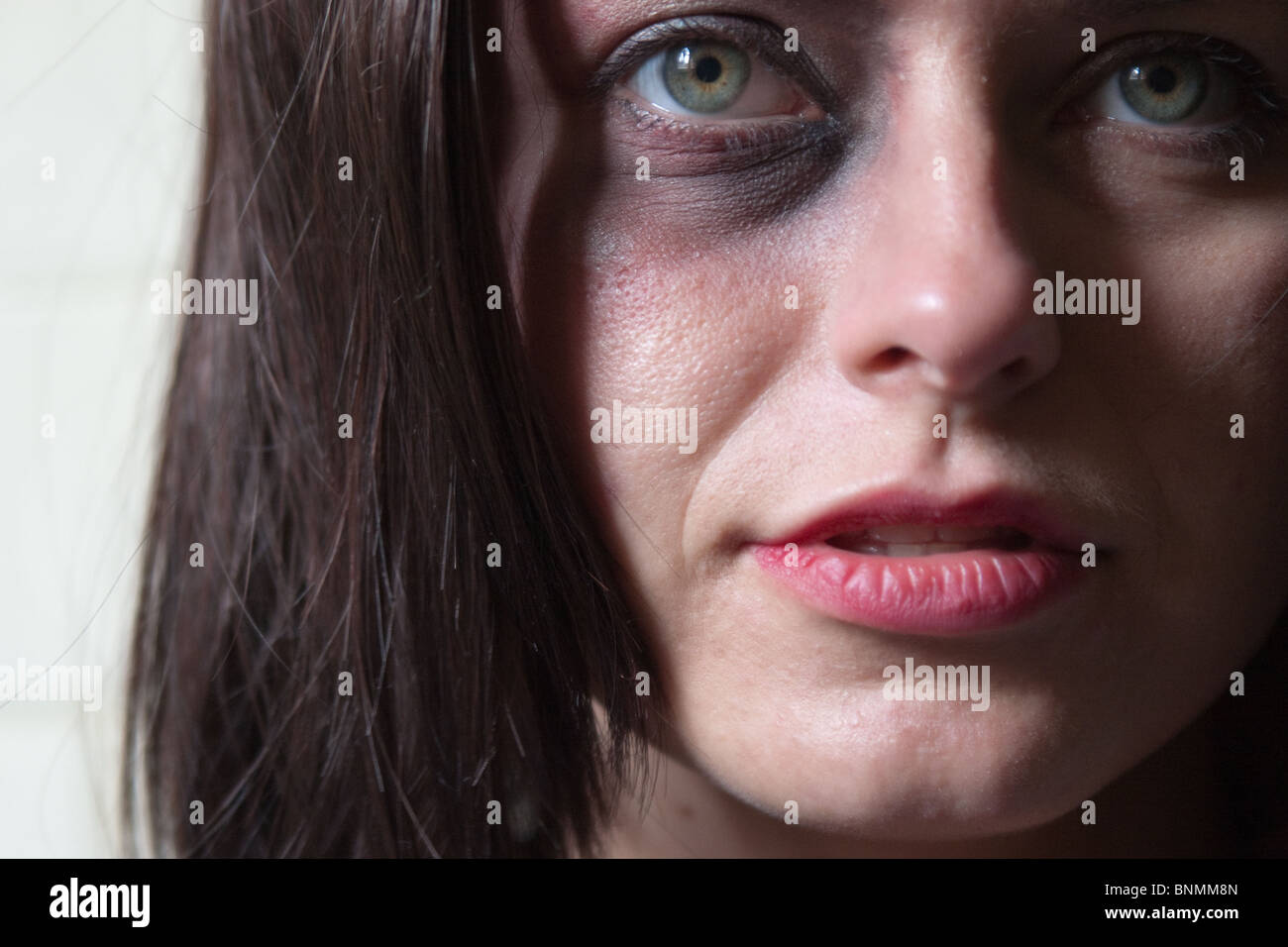 Close-up of beautiful woman with bruised eye Stock Photo