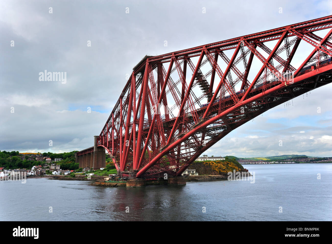 Train riding the Forth Railway Bridge / Forth Rail Bridge over the Firth of Forth near Edinburgh, Scotland, UK Stock Photo