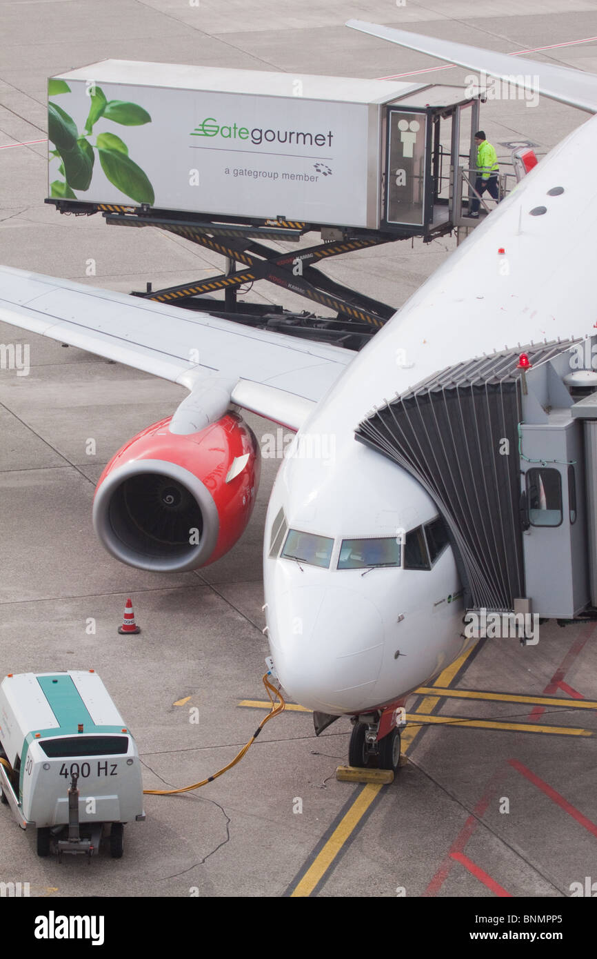 Aeroplane with Gate Gourmet lorry at Dusseldorf International Airport Stock Photo