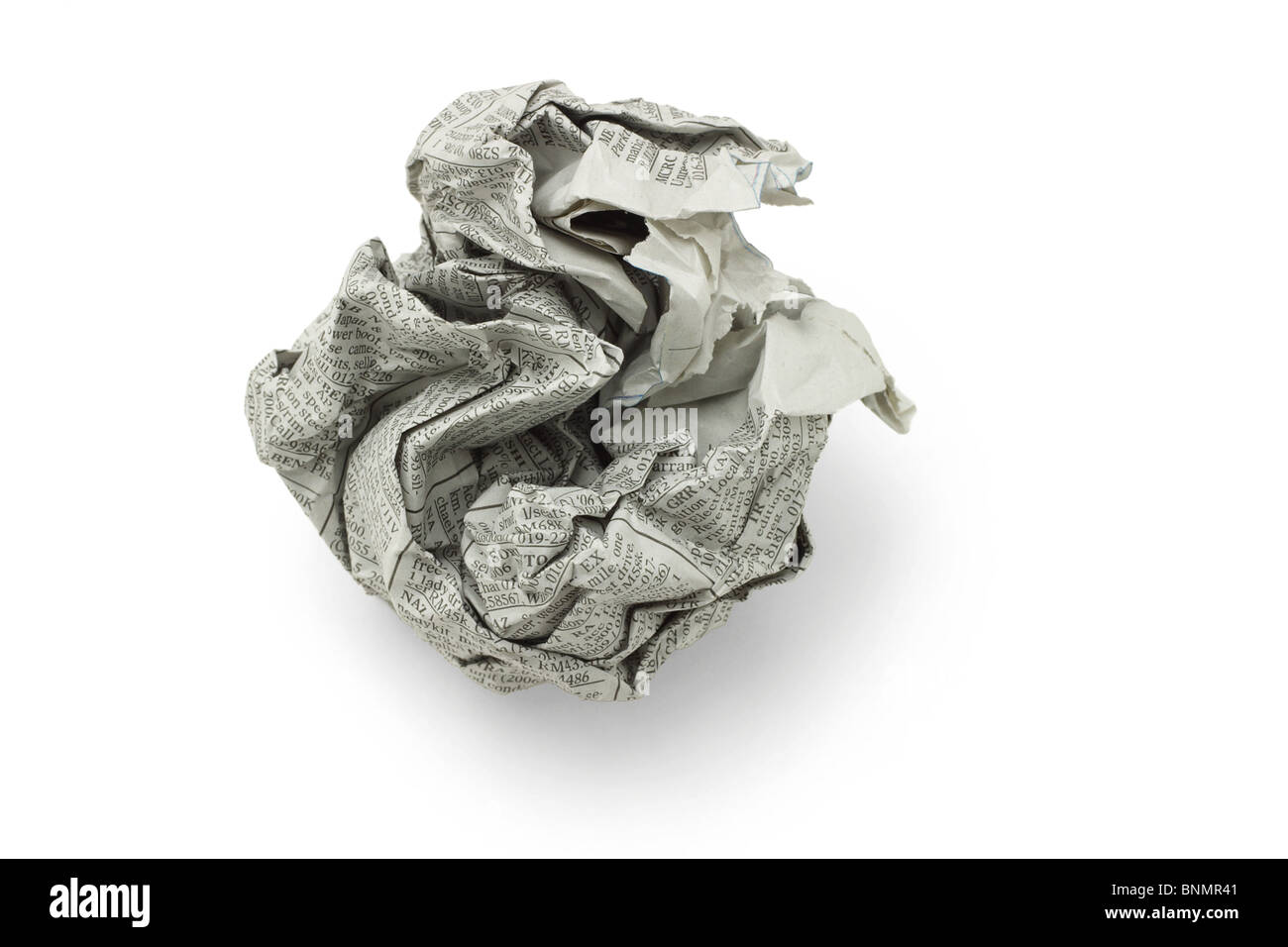 Crumpled newspaper in shape of ball on white background Stock Photo