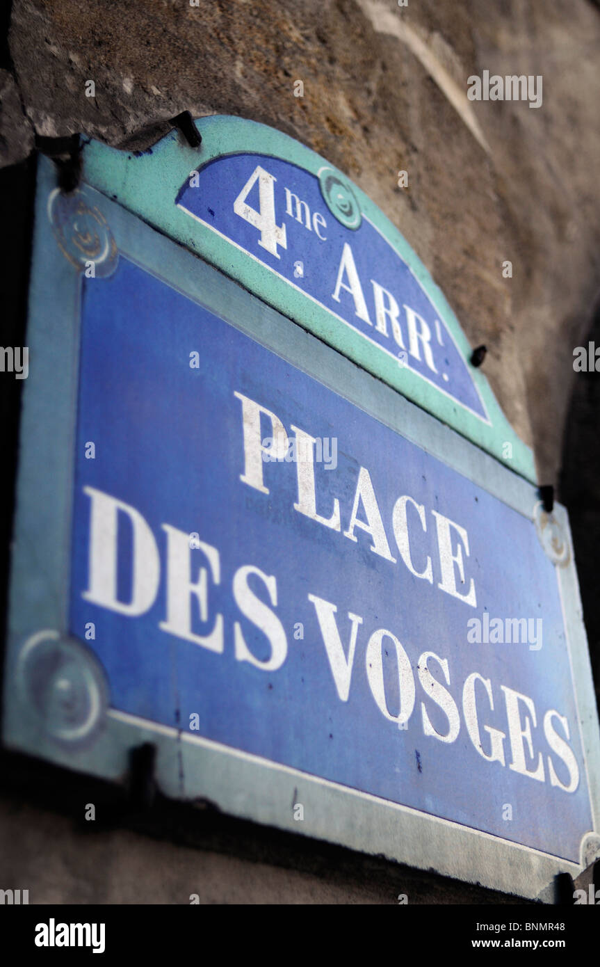 Street sign 'Place des Vosges' indicating the famous medieval-era square in central Paris, France. Stock Photo