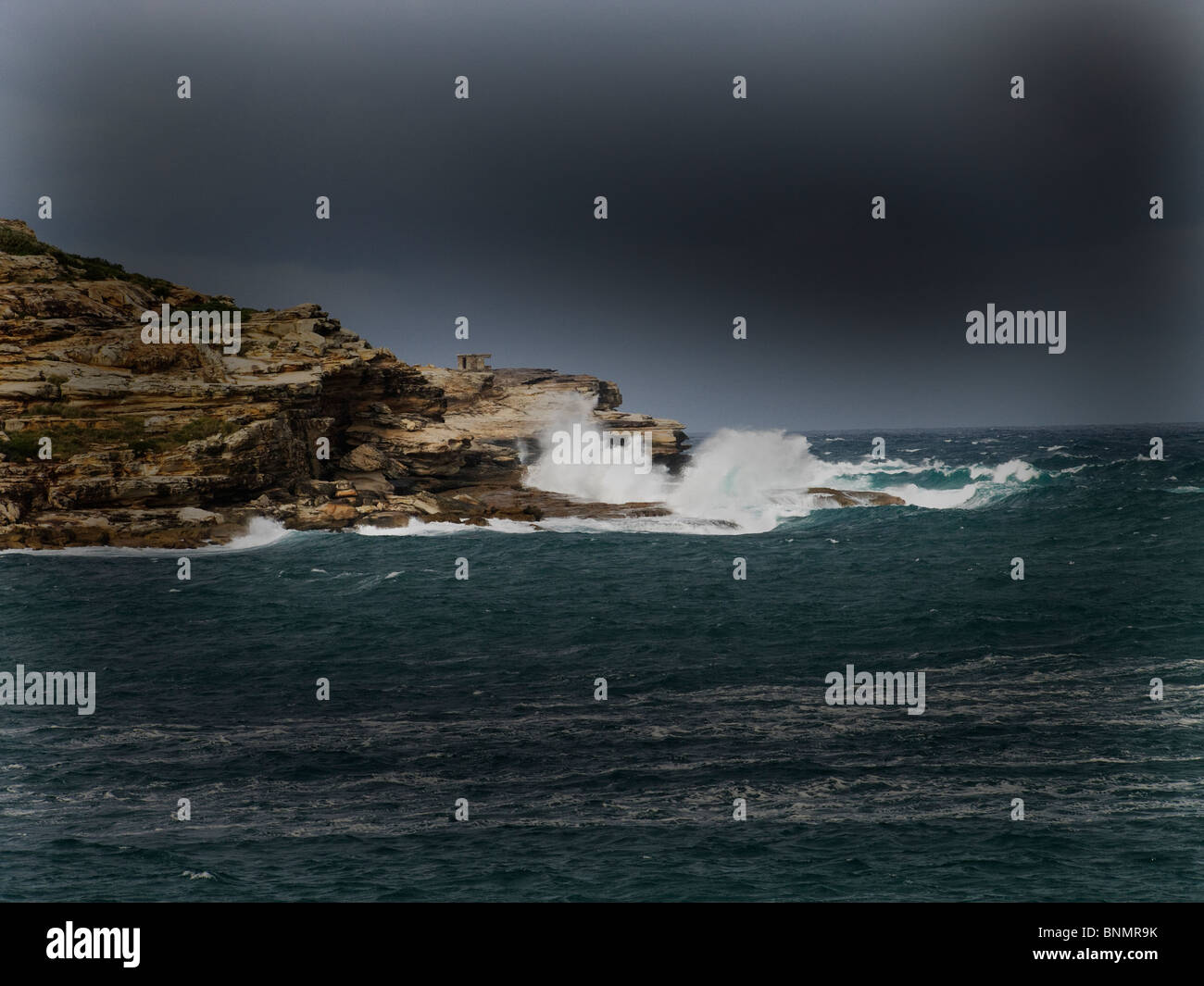 Stormy seas and waves off a headland at Long Bay, Sydney, New South Wales, Australia site of shipwreck of ss Malabar Stock Photo