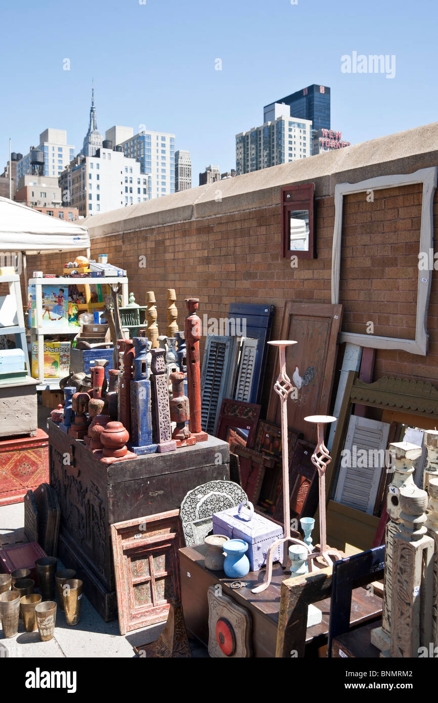 frames shutters & handsome painted wood turned pieces from India displayed for sale at Hells Kitchen Weekend flea market NYC Stock Photo