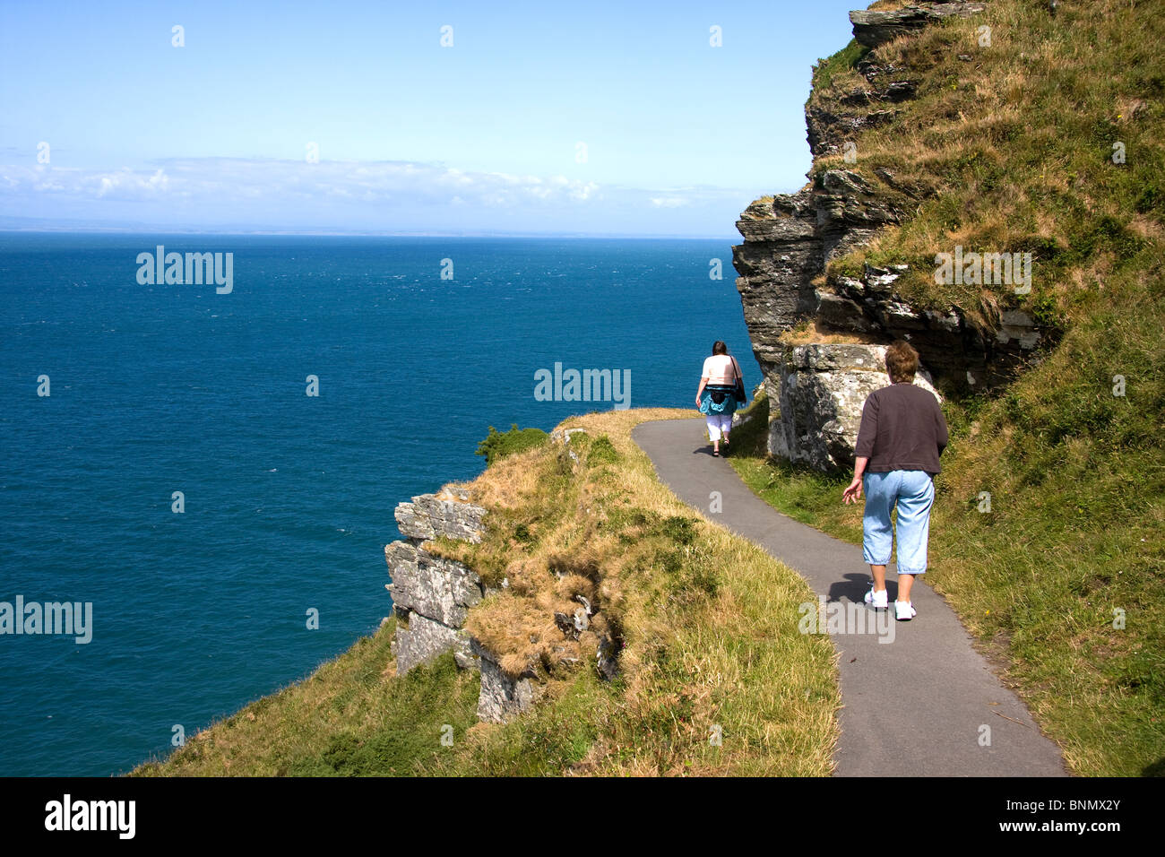 Walking on the path in the valley of the rocks in Exmoor national park Stock Photo