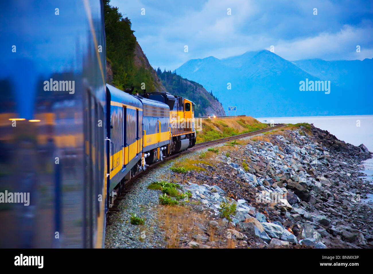 Alaska Railroad travels along Turnagain Arm in Alaska during Summer, HDR image Stock Photo