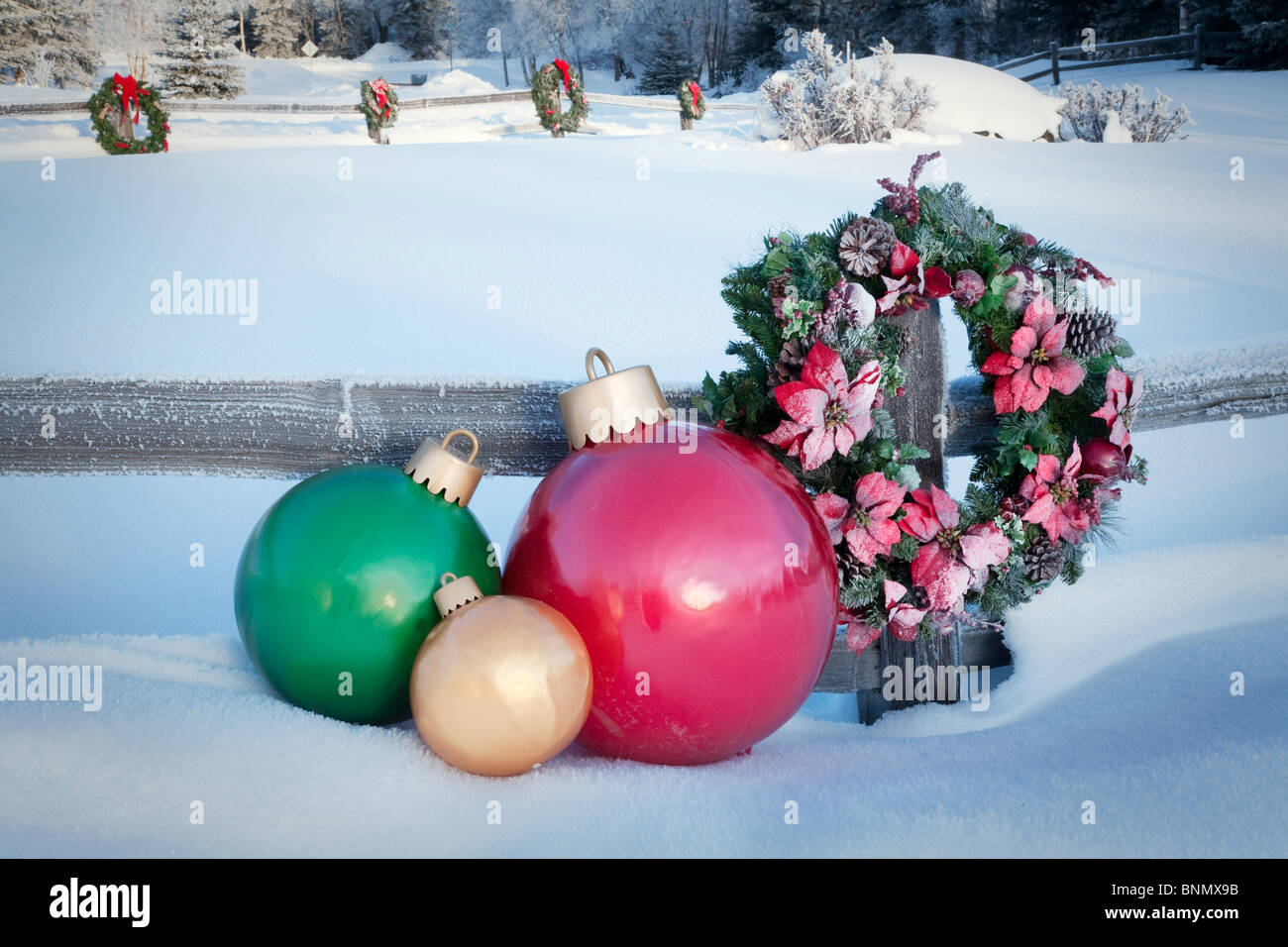 Split Rail Fence Decorated With Christmas Wreaths And Decorations