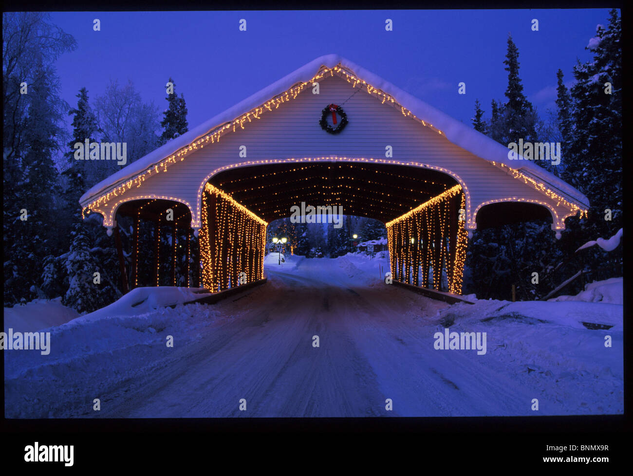 Covered Bridge w/Christmas Lights Anchorage SC Alaska winter Stock Photo